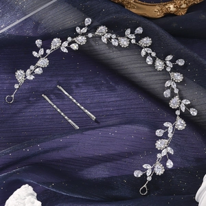 Detailed close-up of sparkling floral bridal headband with silver crystals and leaves