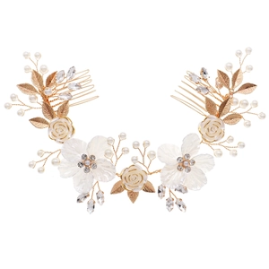 Elegant bridal hair comb with white flowers, gold leaves and pearls on white background