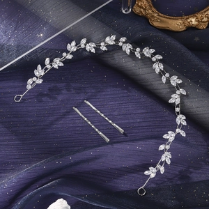 Close-up of handmade silver leaf bridal hair vine with marquise zircon stones and bobby pins