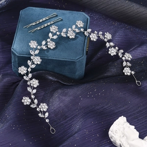 Detail of silver bridal hair vine with shimmering zircon crystals on dark velvet