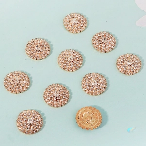 Detailed macro view of 10-piece set of sparkling sunflower rhinestone flatback buttons