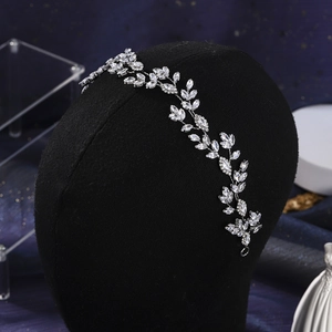 Detail of silver bridal hair vine with marquise crystals on black mannequin head