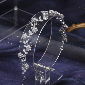 Detail of silver floral bridal crown with crystals and leaf-shaped cubic zirconia