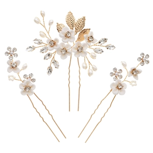 Three-piece bridal hair pin set with white resin flowers and golden alloy leaves