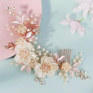 Elegant bridal hair comb with white shell flowers, pearls and crystals on gold wire