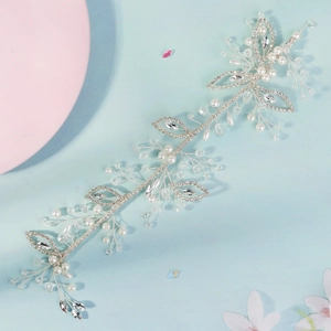 Silver bridal hair vine with handmade pearls and crystal leaves for wedding hairstyles
