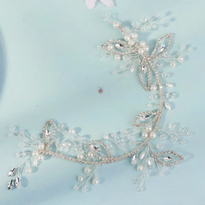 Detailed view of handmade silver bridal hair vine with pearls and marquise crystals