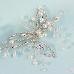 Detail of bridal headband with pearls, crystals and handcrafted silver wire leaves