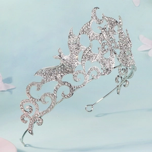 Silver gothic bat crown with white rhinestones for Halloween costume on blue background