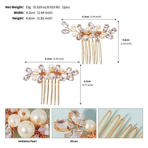 Detail showing two pieces of gold wedding hair combs with imitation pearls and zircons