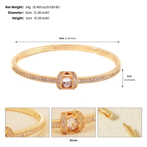 Close-up of gold-plated marine bangle with zircon inlay and detailed clasp dimensions