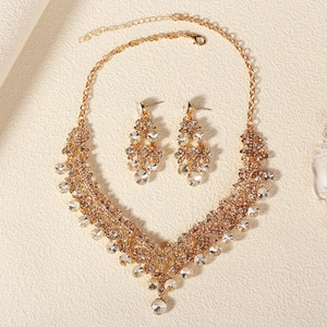 Elegant bridal jewelry set with sparkling rhinestones and golden floral necklace and earrings