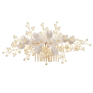 White resin floral hair comb with faux pearls and gold wire for bridal wedding hairstyles