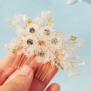 Exquisite handmade crystal flower hair comb with white petals and gold wire for weddings