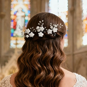 Elegant bridal hair pins set with white flowers and pearls for wedding hairstyles