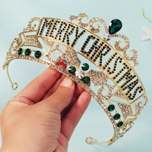 Detail of Christmas gold crown headband with colorful rhinestones and festive lettering