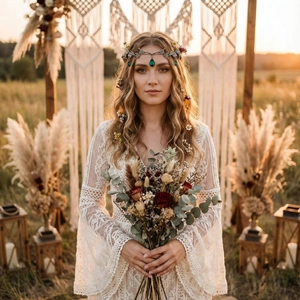 Detail of bohemian silver crown with green teardrop gemstones on lace dress