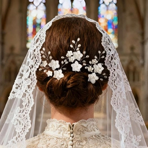 U-shaped bridal hair pin with white resin flowers and pearls for wedding hairstyles