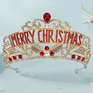 Detailed macro view of the gold alloy crown with vibrant red Merry Christmas rhinestones