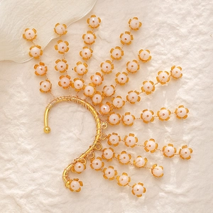 Elegant gold wire ear cuff with pink crystal flowers and forest vintage design