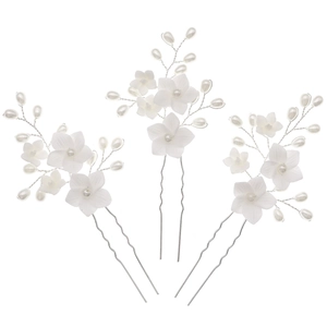 Set of three bridal U-shaped hair pins with white flowers and pearls for wedding hairstyles