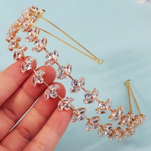 Detailed view of the gold headband featuring marquise-shaped zircons in leaf patterns