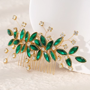 Exquisite gold bridal hair comb with emerald crystals and sparkling rhinestones for parties