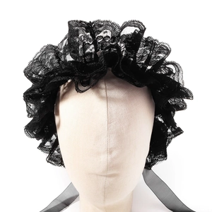 Close-up of black lace ruffles and sheer ribbon on a Lolita circus-style neck piece