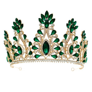 Luxurious gold bridal tiara with emerald green rhinestones for pageant or wedding