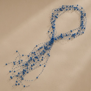 Macro detail of multilayer dark blue pearl beads for bridal wedding hair decoration