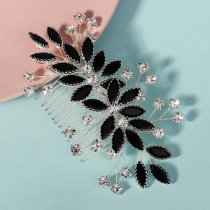 Close-up of black rhinestone leaf hair comb with vine design and silver alloy finish