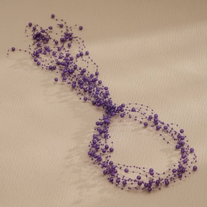Elegant bridal hair band with handcrafted purple pearls and multi-layer bead design