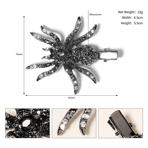 Macro detail of rhinestone spider hair clip showing crystal legs and duckbill clip mechanism