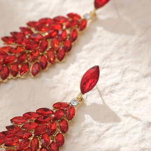 Vintage bridal earrings with red marquise crystals in geometric leaf design on gold base