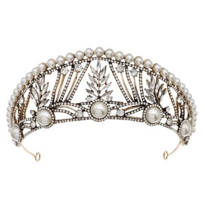 Vintage gold bridal crown with white pearls and sparkling crystals on a white background