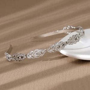 Elegant silver leaf headband with shimmering rhinestones for bridal or daily style