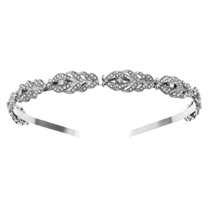 Detailed close-up of a silver tiara headband with crystal leaf patterns and fine rhinestones