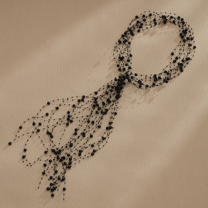 Handmade black beaded fringe necklace with multilayered woven mesh design for bridal hair