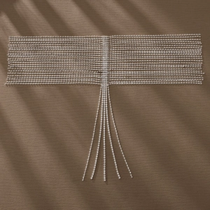 Detailed macro view of layered rhinestone bridal hair chain with long hanging tassels