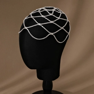 Detailed close-up of crystal mesh bridal hair chain with sparkling rhinestone fringe