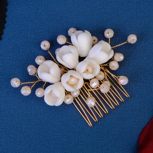 Handmade ceramic flower hair comb with pink crystals and pearls for bridal hairstyles