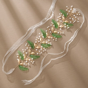 Handmade bridal hairpiece with gold wire, green resin leaves, and pearls with silk ribbons
