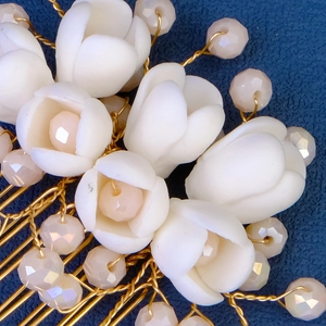 Elegant Chinese bridal hair comb with white tulip petals, pink crystals, and pearls on gold wire
