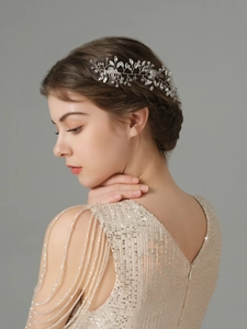 Detailed close-up of handmade bridal hair comb with marquise rhinestones and white pearls