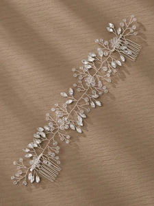 Detailed view of silver bridal hair comb featuring marquise crystals and woven beads