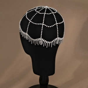 Close-up of silver rhinestone tassel head chain with intricate web pattern and crystals
