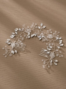 Detailed macro view of handmade bridal hair comb with marquise rhinestones and silver wire