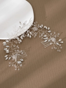 Detail of silver bridal hair vine with marquise crystals and dual side combs for styling