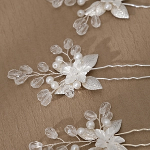 Exquisite bridal hair pins with silver handmade beadwork and crystal floral motifs