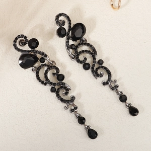 Baroque black crystal drop earrings with pear-shaped facets and ornate vintage metalwork